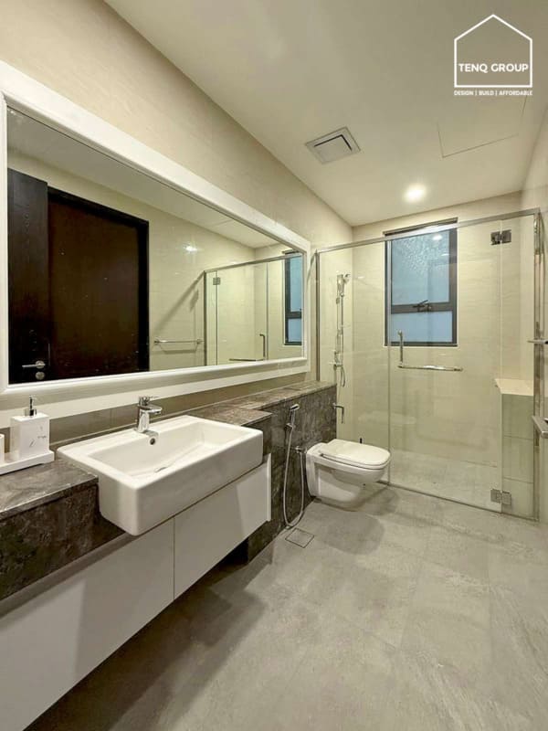 Adding in frameless glass and neutral tile palette to small bathroom